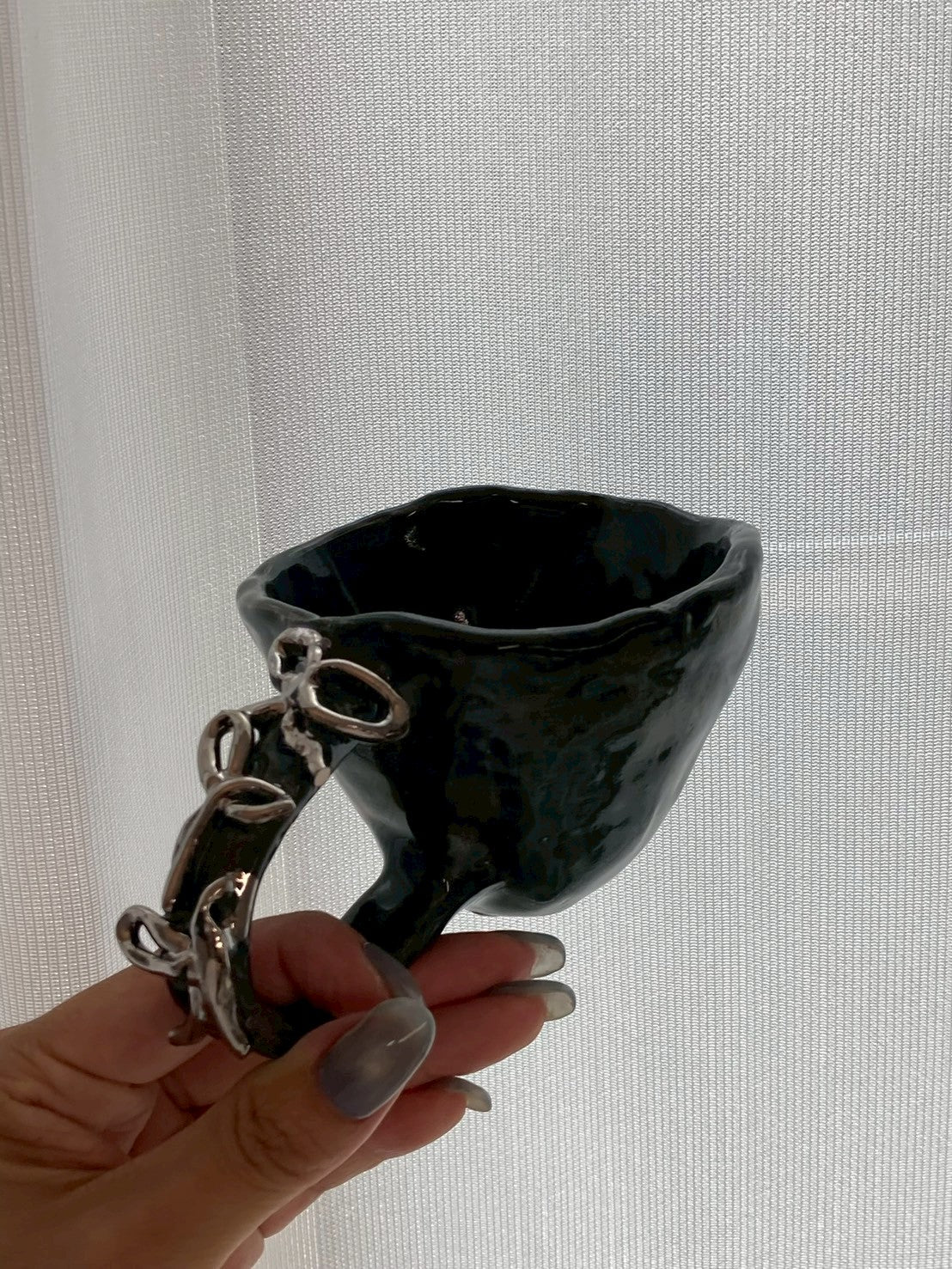 handmade ceramic art object – silver handle