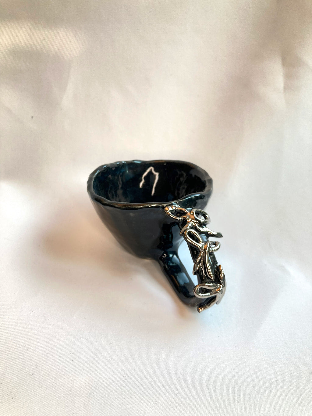 handmade ceramic art object – silver handle